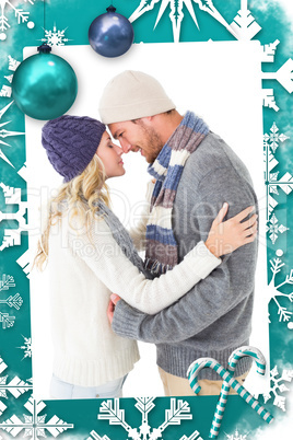 Composite image of attractive couple in winter fashion hugging