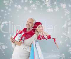 Happy festive couple with gifts and bags
