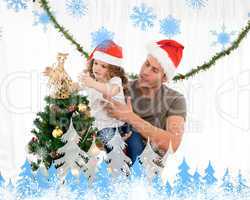 Cute daughter decorating the christmas tree with his father