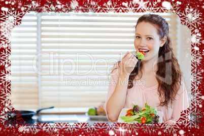 Composite image of girl having healthy salad