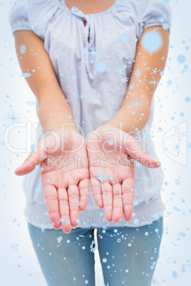 Casual young woman holding hands out