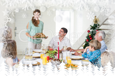 Composite image of mother serving christmas meal to family