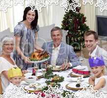Family celebrating christmas dinner with turkey