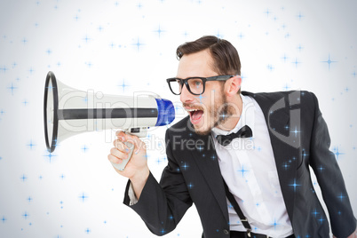 Geeky businessman shouting through megaphone