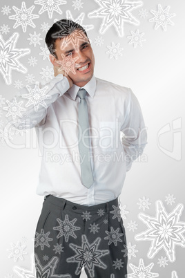 Portrait of a young businessman having a back pain