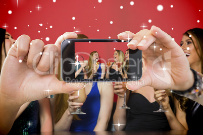 Hand holding smartphone showing photo