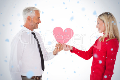 Handsome man getting a heart card form wife