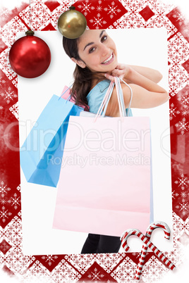Smiling woman posing with shopping bags