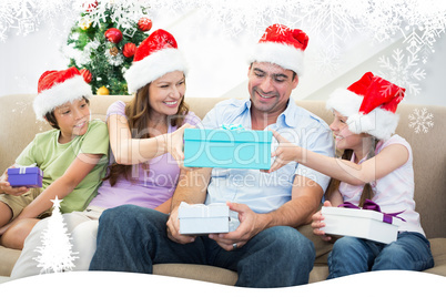 Composite image of family exchanging christmas gifts
