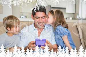 Composite image of loving children gifting father