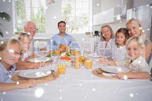 Composite image of family celebrating thanksgiving