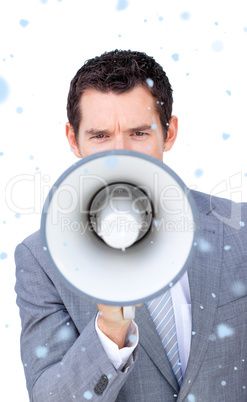 Composite image of angry businessman shouting through a megaphon