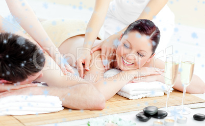 Positive young couple enjoying a back massage