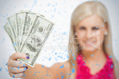 Beautiful blonde holding 100 dollars banknotes