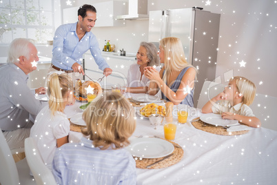 Composite image of smiling father proposing a slice of turkey