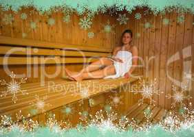 Calm brunette relaxing in a sauna