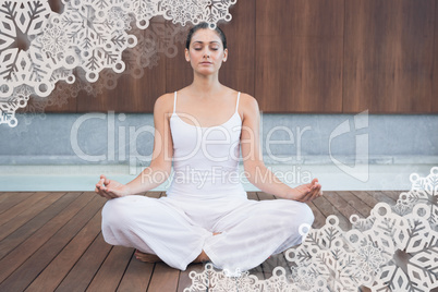 Peaceful woman in white sitting in lotus pose