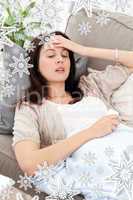 Sck woman lying on the sofa and touching her forehead