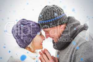 Happy mature couple in winter clothes embracing