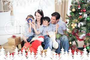 Composite image of happy family having fun with christmas presen