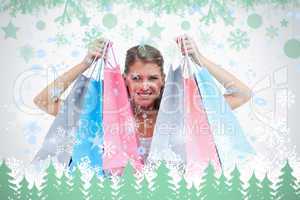 Joyful woman holding shopping bags