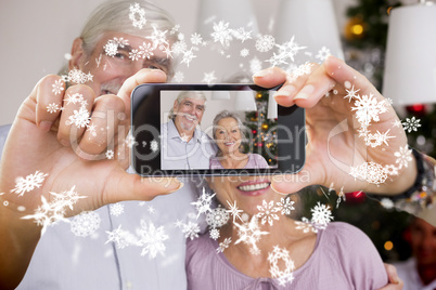 Hand holding smartphone showing photo