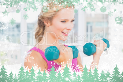 Composite image of happy blonde lifting dumbbells