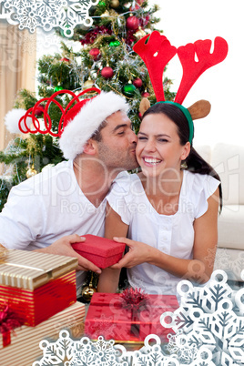 Smiling couple giving presents for christmas