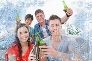Group of friends celebrating by clinking bottles together