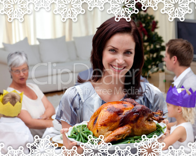 Woman showing christmas turkey for family dinner