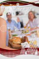 Woman bringing the turkey to the dinner table