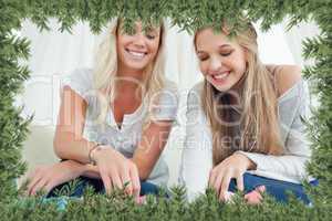 Smiling girls looking into the bags below them