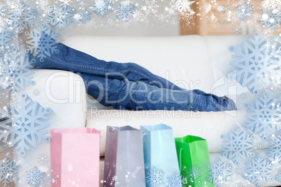 Woman relaxing on the sofa after shopping tour