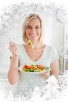 Bblonde woman eating a mixed salad