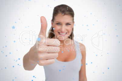 Smiling woman with the thumb up