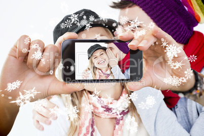 Hand holding smartphone showing photo