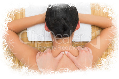 Peaceful brunette enjoying a back massage