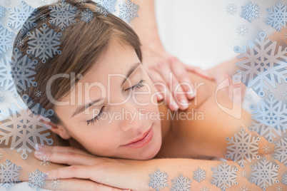 Attractive woman receiving back massage at spa center