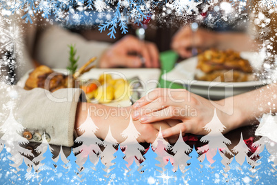 Composite image of close up on loving couple holding hands