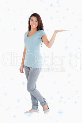 Composite image of pretty woman showing a copy space while stand