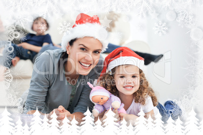 Happy mother and daugher at christmas lying on the floor