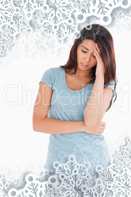 Composite image of sad beautiful woman standing