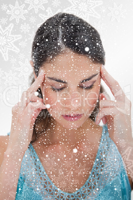 Portrait of a young woman having a headache