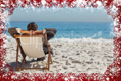 Young businessman relaxing on his sun lounger