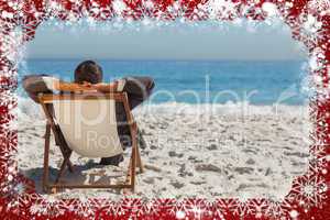 Young businessman relaxing on his sun lounger