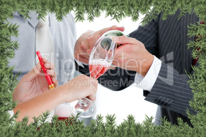 Close up of two colleague drinking champagne to celebrate christ