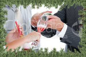 Close up of two colleague drinking champagne to celebrate christ