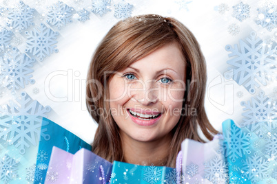 Composite image of radiant woman with shopping bags