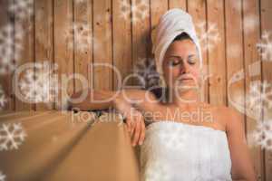 Calm woman relaxing in a sauna