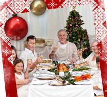 Family tusting with white wine in a christmas dinner